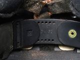 a close up of a belt with a button on it