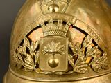 a gold helmet with a crown on top of it