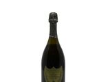 an image of a bottle of champagne sitting on top of a table