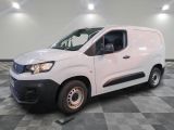 a picture of a white van parked on a checkered floor