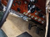 a dashboard of a car with many knobs on it