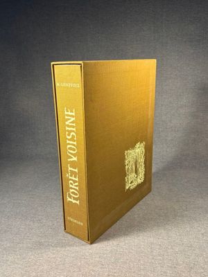 an image of a book with a gold cover sitting on a table