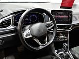 a steering wheel and dashboard of a car in a showroom