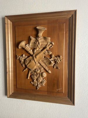 a picture of a wall hanging with a bunch of items on it