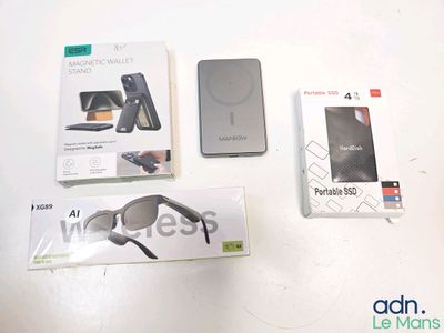 three boxes of electronic gadgets sitting on a table