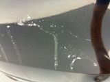a close up of a toothbrush in a bowl of water