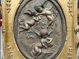 an image of a picture of a bronze plaque with angels on it