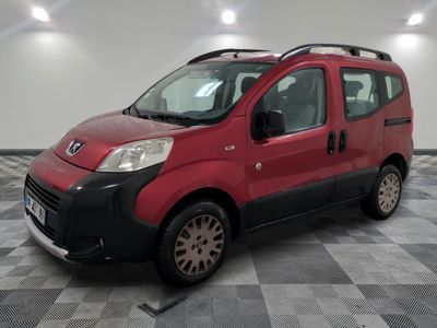 a picture of a small red van parked in a garage