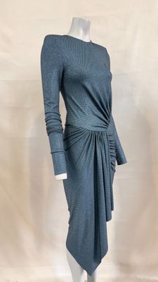 the mannequin is wearing a gray dress with long sleeves