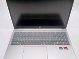 an open laptop computer sitting on top of a white table