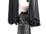 an image of a black dress on a mannequin stand