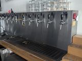 a picture of a bar with a bunch of beer taps