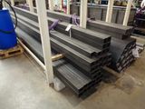 many different types of steel pipes in a warehouse