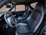 the interior of a car with black leather seats and a steering wheel