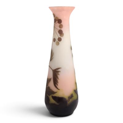 a vase that has a bird on it on a white background