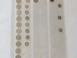a lot of coins in a plastic bag on the table