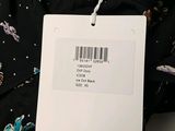 a picture of a black and white floral shirt with a price tag on it