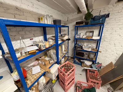 a room filled with lots of boxes and shelves