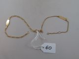 two gold bracelets with a tag that says 60 on them