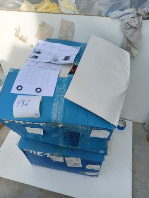 a stack of boxes sitting on top of a white table