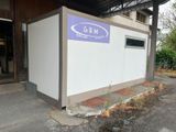 a small building with a sign on the side of it