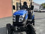 the blue tractor is parked in front of a building