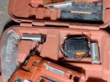 an orange tool case with tools in it on the floor