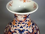 a vase with a blue and orange design on it