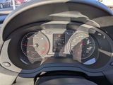 a close up of a car dashboard with a speedometer and gauges