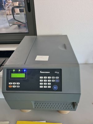 an image of a computer and a printer on a desk
