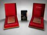 an image of a pair of boxes with a red cover and a gold plated box