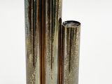 three gold vases sitting next to each other on a white surface