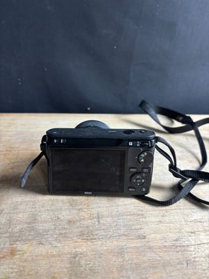 a camera that is sitting on a wooden table