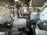a picture of a car engine with a lot of wires attached to it