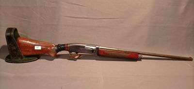 a rifle with a wooden barrel and a wooden handle on a white background