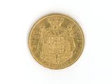 an old gold coin with a coat of arms and a crown on it