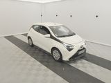 a picture of a small white car in a garage