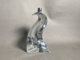 an image of a glass sculpture of a bird on a white background
