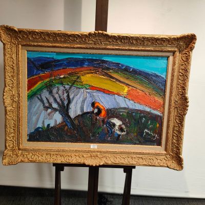 une image d'un tableau sur un chevalet dans une pièce