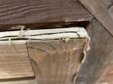 a close up of a piece of wood with a piece of wood sticking out of it