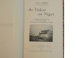 an open book with a picture of a boat in the water