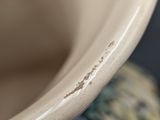a close up view of a ceramic vase with a blue and white pattern
