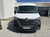 the front of a white van parked in front of a building
