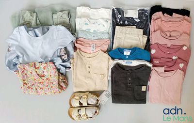 a pile of clothes and shoes on a table