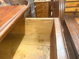 a wooden table with a drawer in the middle of it