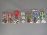 several medals and medals are displayed in a display case