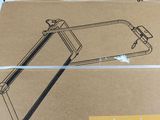 a cardboard box with a saw on top of it