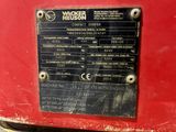 a close up of a sign on a red machine