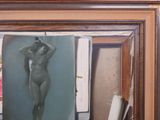 a painting of a nude woman hanging on a wall