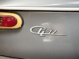 a close up of a car ' s emblem on the back of it
